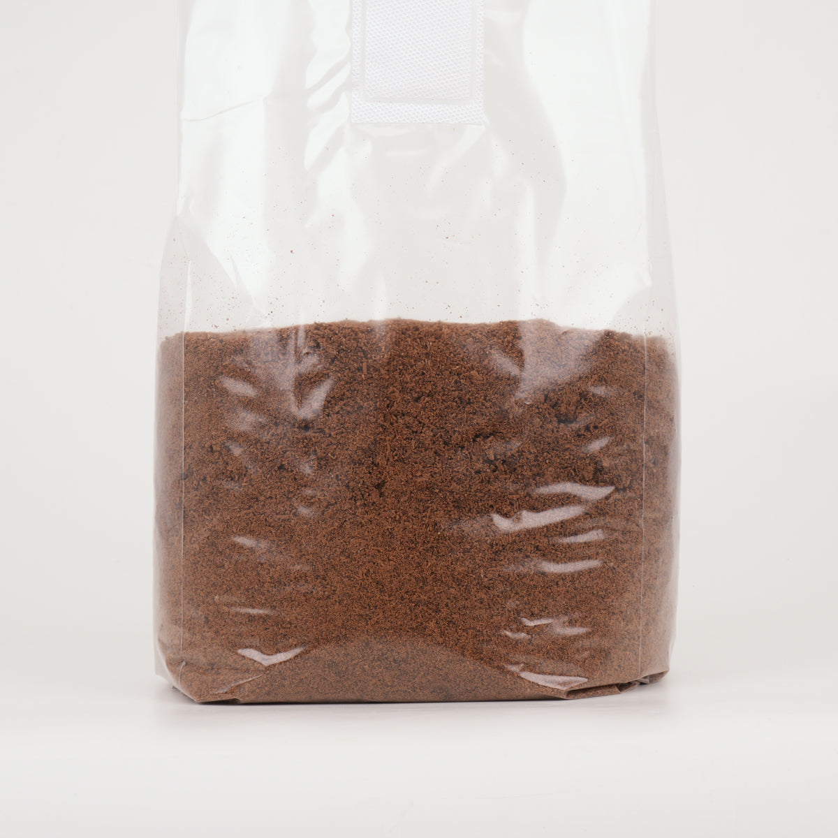 A 4kg bag of MycoPunks "Rise Above" organic hardwood and bran substrate on a white background