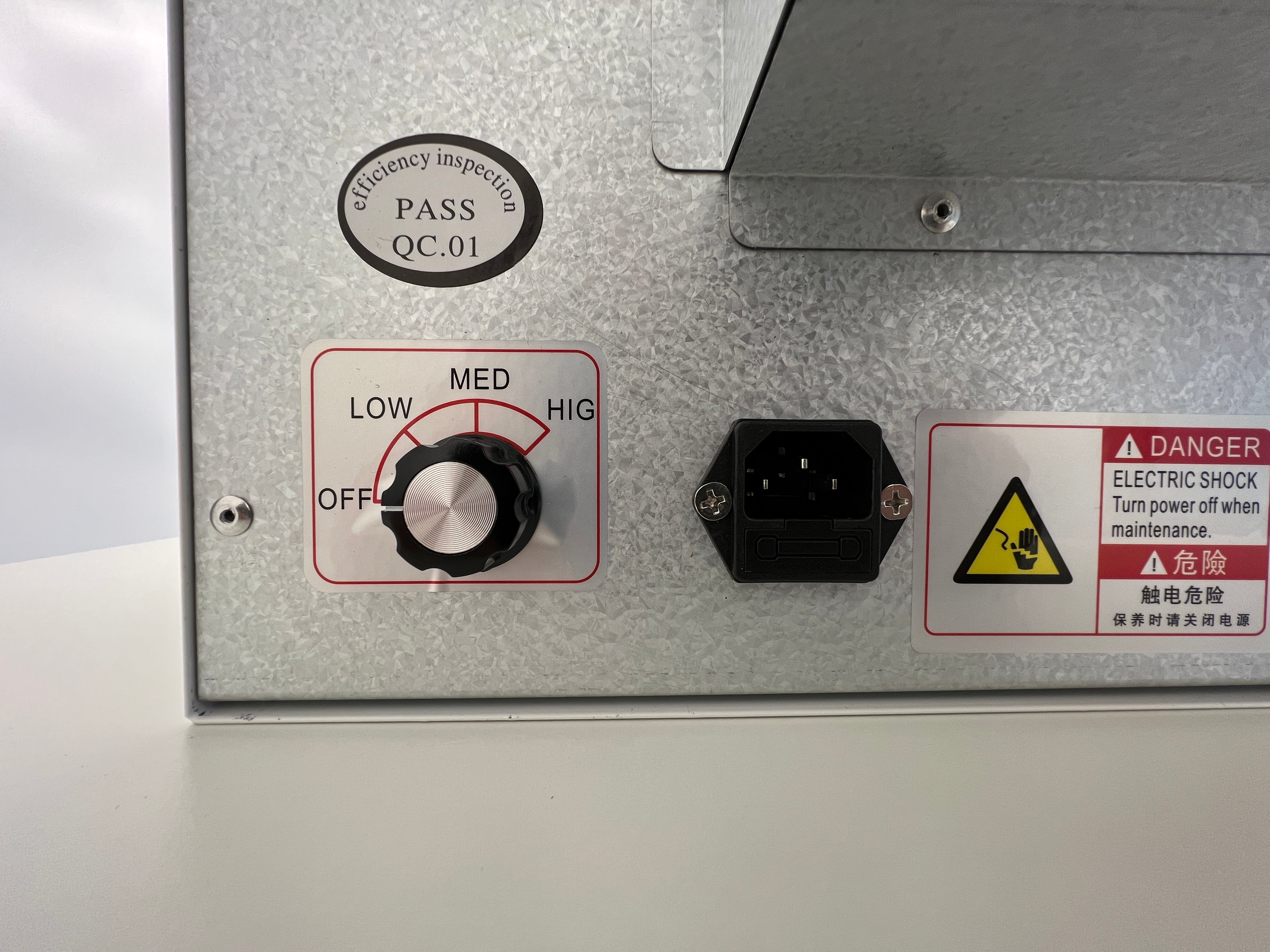 A view of the rear of the MycoPunks V2 Flow Unit, showing the variable power control and plug socket